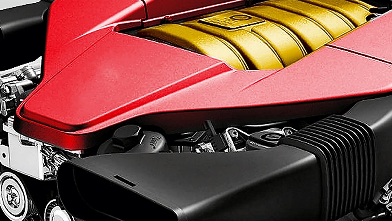 Motor de un coche, con núcleo amarillo y embellecedor rojo